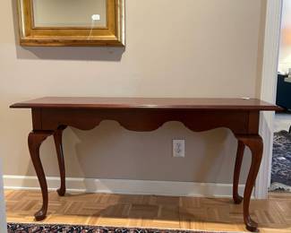 F94 - $125. Knob Creek Entry Table - Solid wood in very good condition. Was covered by a runner and has a 1" stripe down the front that looks like sun fading. Otherwise great condition - very sturdy! Measures 56" x 17" x 27" tall. 