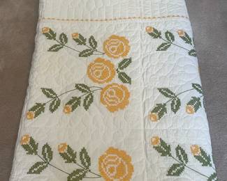 F75 - $50 Quilt. Measures 85" x 78". Has minor light staining. Looks to be hand stitched & cross stitched. 