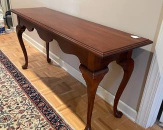 F94 - $125. Knob Creek Entry Table - Solid wood in very good condition. Was covered by a runner and has a 1" stripe down the front that looks like sun fading. Otherwise great condition - very sturdy! Measures 56" x 17" x 27" tall. 