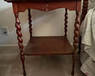 F68 - $50. Wooden Side Table with Barley Twist Legs. Measures 24.25" square x 29.5" tall. Top is veneer. Overall good condition - a little wiggly. 