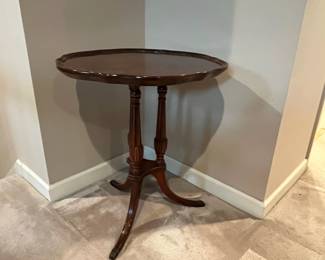 F64 - $60. Vintage Pie Crust Table. Solid Wood - very good condition. Measures 24" across x 27.25" tall. 