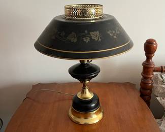 F72 - $30. Tole Painted Black & Brass Metal Table Lamp. Shade is also metal. Measures 18" tall x 15" wide. 