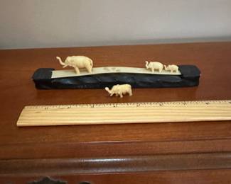 F52 - $10. Carved Elephants on Wooden Base. (I think they're Resin)
