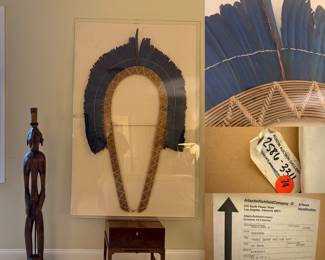 Size (HxW) 56 x 32 x 1 Acrylic Shadowbox  "MONI IAMUR OKO DJE DJO" framed Amazonian feather headdress 