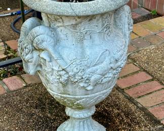 Antique cement ram’s head urn planter