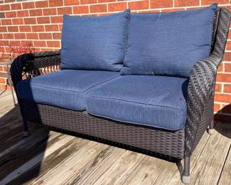 Outdoor resin wicker loveseat, two matching swivel chairs also available