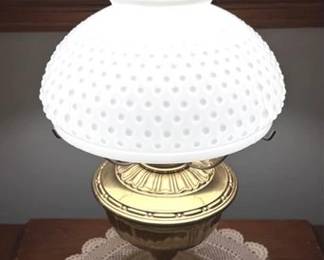 Vintage brass electrified oil lamp with a white hobnail milk glass shade