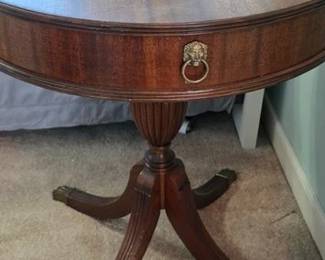 Drum table with single drawer and lion's head knob 
