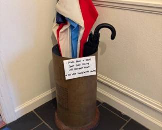 Brass umbrella stand, made from shell casing.  Cool!