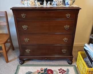 Chest of drawers, always useful!  Hook rug