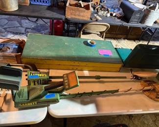 2 GARRETT MEDAL DETECTORS AND A ANTIQUE SUITCASE STYLE FOLD OUT TABLE WITH BENCHES REALLY COOL.