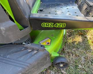 VERY NICE CRZ-428 GREEN MACHINE ZERO TURN WITH 3 SETS OF BATTERIES AND SEPERATE CHARGERS AND GRASS CATCHER SYSTEM WITH ONLY 72 HOURS ON IT.