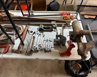 ANTIQUE VISE, LOTS OF CRESCENT WRENCHES AND A WONDERFUL SUPPLY OF CLAMPS.