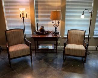 SWEET ANTIQUE CHAIRS 1 IS A ROCKER AND TABLE WITH LAMPS.