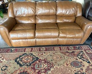 VERY NICE RECLINING LEATHER SOFA.