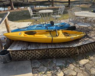 2 NICE PELICAN KAYAKS WITH PADDLES.
