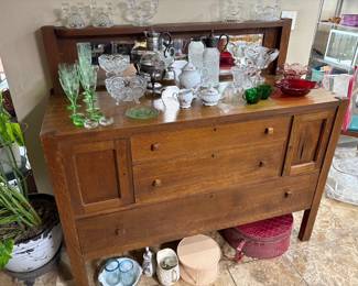 BEAUTIFUL ANTIQUE SIDEBOARD AND MORE INCLUDING VASELINE GLASS ON TOP.
