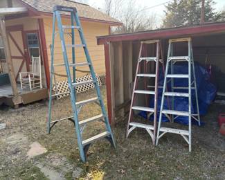 SEVERAL NICE 6 AND 8 FOOT FIBERGLASS LADDERS.