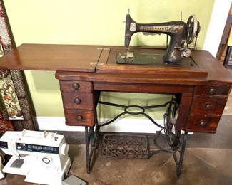 ANTIQUE FRANKLIN TREADLE SEWING MACHINE AND CABINET.