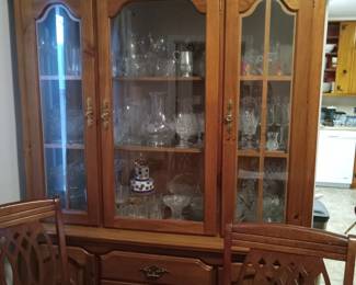 Wood China Cabinet matches the Wood Dining Room table with a leaf and 6 chairs. Lots of beautiful glassware, vintage pieces.