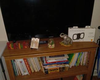 Bookshelf with cookbooks,  books, TV