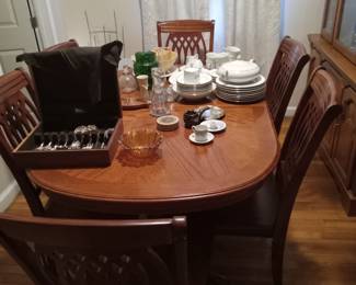 Wood Dining room table with a leaf and 6 chairs. Fine China. Serving pieces, vintage glassware, vintage pitchers.