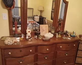 Triple dresser with a trio of mirrors, Southern Living angels, collectibles. 