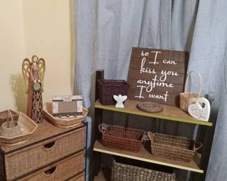 Wicker chest with drawers, baskets, lighted angel, signage, shelves
