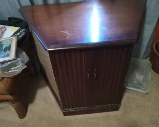 Vintage stereo console speaker cabinet with built-in record player.
