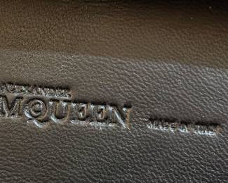 Alexander McQueen Skull Ring Knuckle Clutch.. soft black leather with stainless behind the leather. The clasp is dis functional and needs repair but good condition.