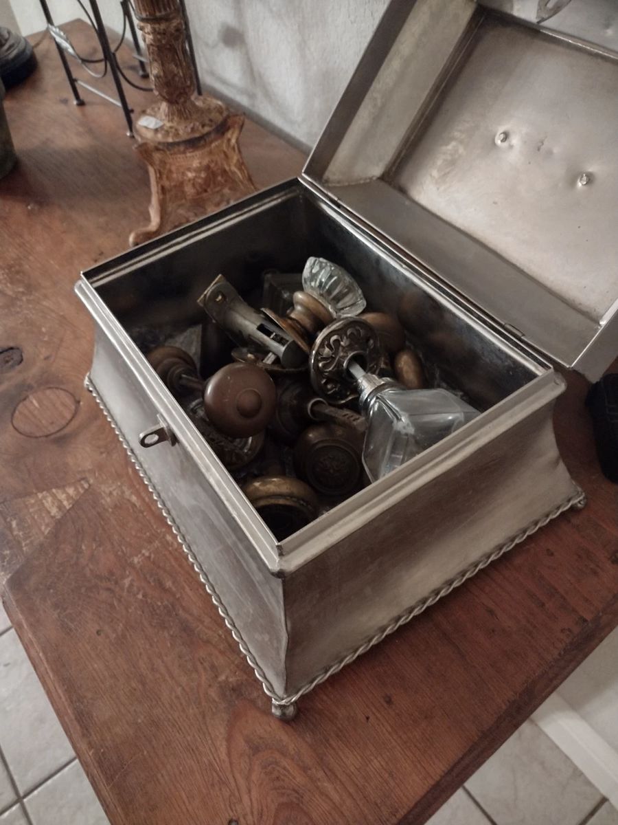 Antique doorknobs and hardware in glass, brass, wood.