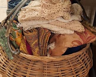 Large basket full of placemats and matching napkin sets