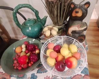 Several bowls with artificial fruit