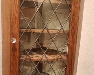 Unique corner cabinet with glass front