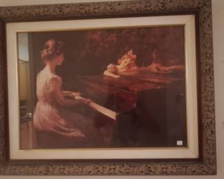 One of the framed art pieces in the hallway