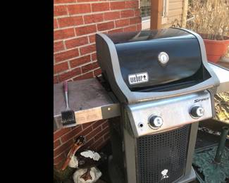 Weber gas grill! Out in the garage is a Weber table top grill and a small gas cylinder table top grill!