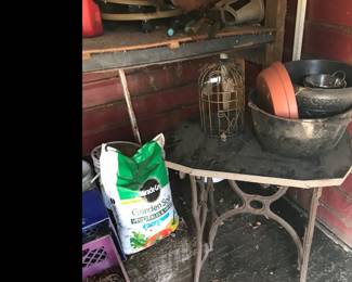 Slate piece on top of an old sewing stand!