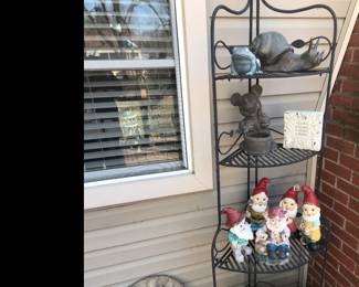 Out back on the deck! More gnomes and garden statues displayed on corner metal stand!