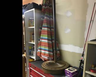 New patio umbrella with pole and a storage container that has a hole for the pole!