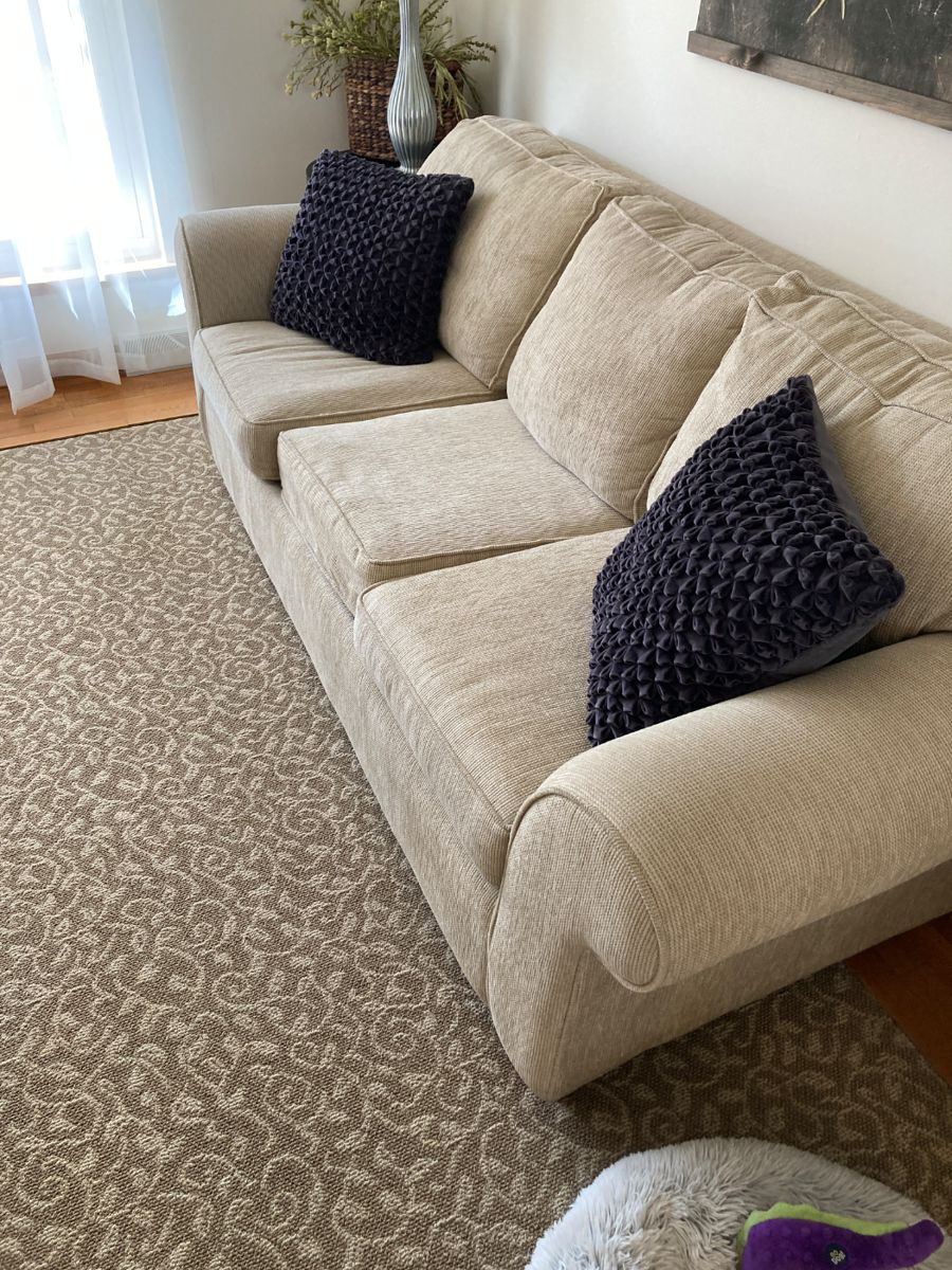 Sofa and matching loveseat with removable seat covers for easy cleaning.