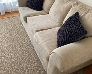 Sofa and matching loveseat with removable seat covers for easy cleaning.