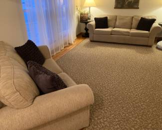 Sofa and matching loveseat with removable seat covers for easy cleaning.