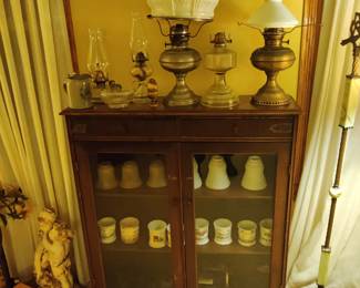 Oil lamps, glass lamp shades, antique glass case
