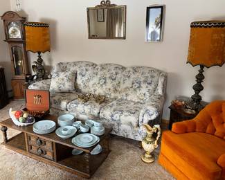 MCM Brass Velvet Shade Lamps; MCM End Tables and Coffee Table; Howard Miller Grandmother Clock; Orange Button Arm Chair; England Couch; 