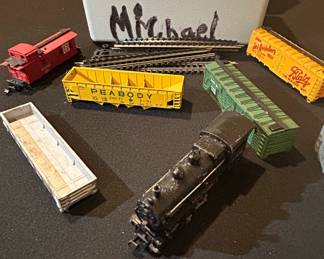 Assorted Model Train Cars and Track Pieces second image