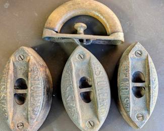 THREE Antique irons with interchangeable wooden handle