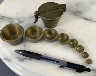Nesting brass traveling scale weights