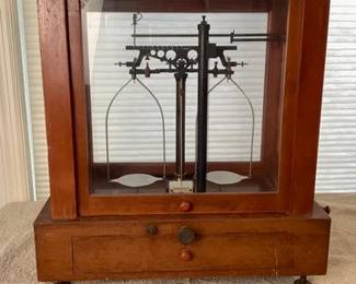 Assay scale in glass case