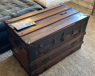 Large, heavy wooden trunk. 