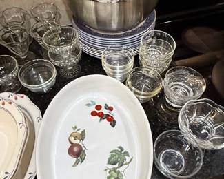 Assorted Glassware and Serving Dishes with Fruit Motif Platter and Stainless Steel Mixing Bowls
